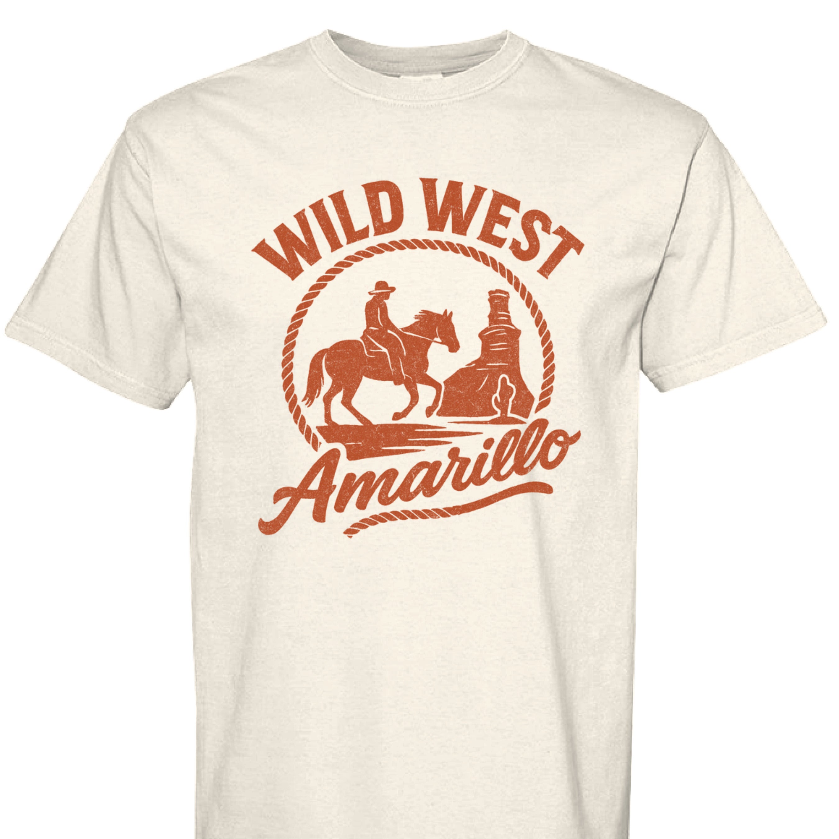 White shirt featuring a orange graphic of a cowboy riding a horse towards the Palo Duro Canyon Lighthouse and text reading 'Wild West Amarillo'